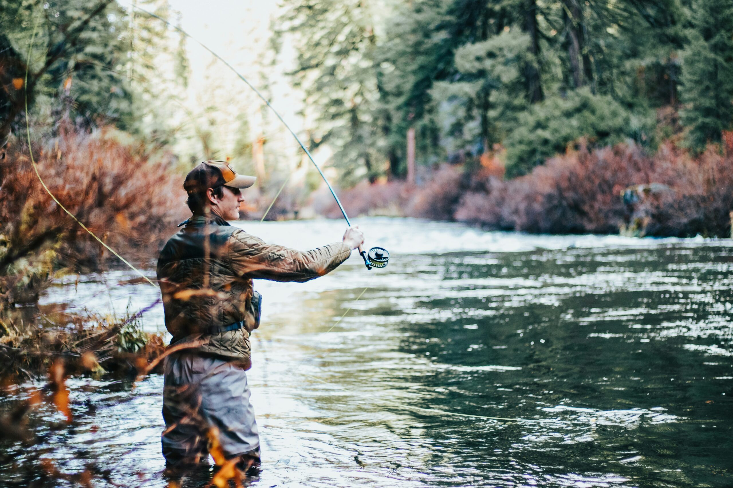 a man fishing in a river